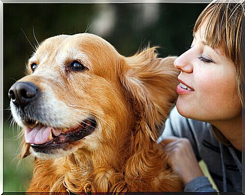 woman hugging dog